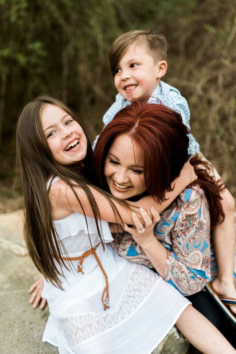 Amy Corn enjoys her children during happier times. Corn suffered from postpartum depression after the birth of both children. CONTRIBUTED