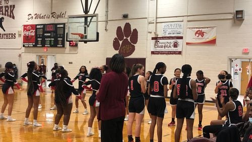 The Woodward Academy girls prepare to take the court against Forest Park on Jan. 26, 2022. Woodward won the game 70-64.