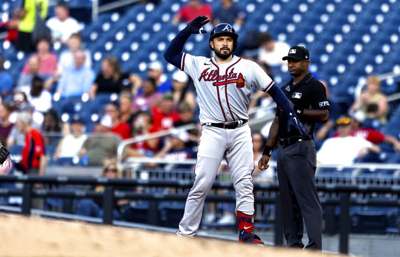 Atlanta Braves' Travis d'Arnaud celebrates at first after a single during the second inning of the team's baseball game against the Washington Nationals on Tuesday, June 14, 2022, in Washington. (AP Photo/Julia Nikhinson)