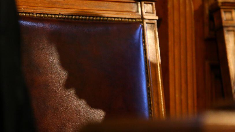 011415 ATLANTA: The shadow of Speaker of the House David Ralston is cast across his chair in the House chambers during Governor Nathan Deal's State of the State address to a joint session during legislative day 3 on Wednesday, Jan. 14, 2015, in Atlanta. Curtis Compton / ccompton@ajc.com The shadow of Speaker David Ralston is cast across his chair in the House chambers during Gov. Nathan Deal's State of the State address to a joint session on Wednesday. Curtis Compton, ccompton@ajc.com