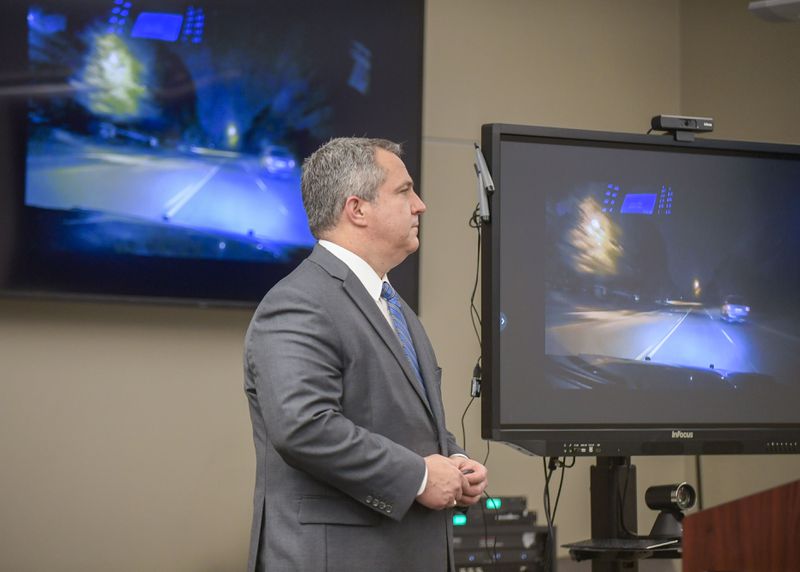Jason Saliba, Cobb's Deputy Chief Assistant District Attorney, shows reporters video footage related to the fatal police shooting.