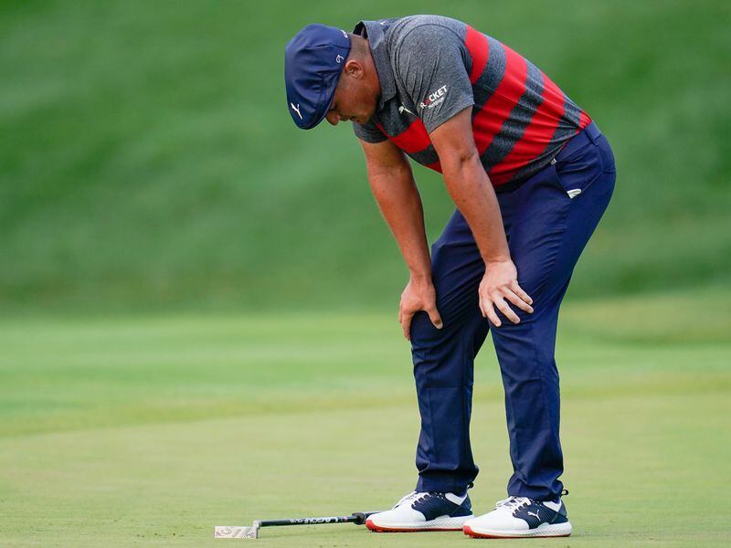 Bryson DeChambeau reacts after missing a putt on the 17th green, the third playoff hole against Patrick Cantlay during the final round of the BMW Championship golf tournament, Sunday, Aug. 29, 2021, at Caves Valley Golf Club in Owings Mills, Md. (Julio Cortez/AP)