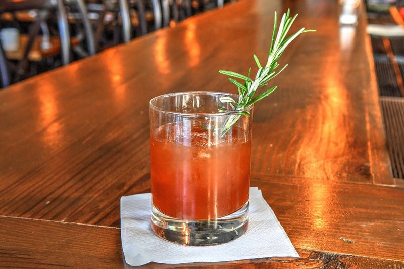 A Rosemary’s Baby, prepared by Kasey Emmett, who heads the bar program at the Pinewood in Decatur, includes pomegranate molasses. STYLING BY KASEY EMMETT / CONTRIBUTED BY CHRIS HUNT PHOTOGRAPHY