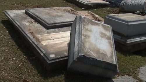 Several headstones were destroyed when an alleged drunk driver crashed into them. (Credit: Channel 2 Action News)