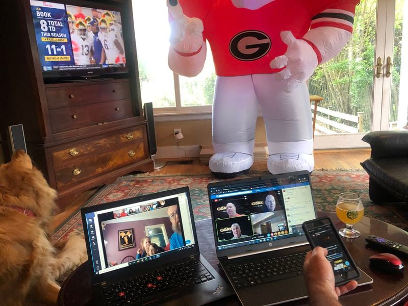 UGA alums Mary Catherine and Warren Kolbert watch 'Virtual G-Day' via their electronic devices from their living room in Richmond, Va. (Photo by Mary Catherine Kolbert)