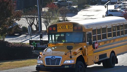 A Gwinnett school bus makes its way for drop offs in Duluth on Tuesday, November 7, 2023. Several metro Atlanta school districts are canceling in-person classes Tuesday because of anticipating freezing temperatures. (Hyosub Shin / Hyosub.Shin@ajc.com)