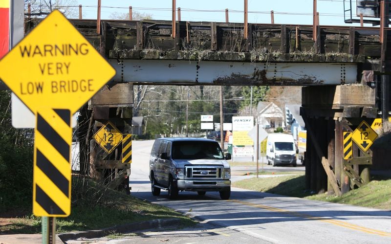 The bridge’s clearance is 12 feet, and there have been 31 incidents in the last 8 years. (Photo: EMILY HANEY / emily.haney@ajc.com)