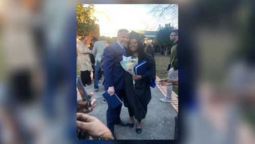 Latonya Young and Kevin Esch pose for a picture at a December 2019 ceremony in which she received a criminal justice degree from Georgia State University. Esch, who met Young a year earlier when he was an Uber passenger in her vehicle, paid a student debt for her. CONTRIBUTED.