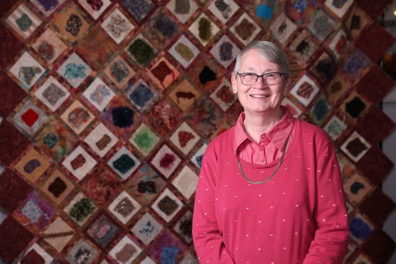 Quiltmaker Maryagnes Kerr is shown with one of her pieces at Clairmont Place. JASON GETZ / SPECIAL TO THE AJC