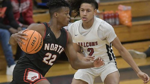North Gwinnett’s Kyle Spence (22) drives to the basket against Pebblebrook’s Nyle Hillmon during their Class 7A state quarterfinal game at Pebblebrook High School Wednesday, March 3, 2021. (PHOTO/Daniel Varnado)
