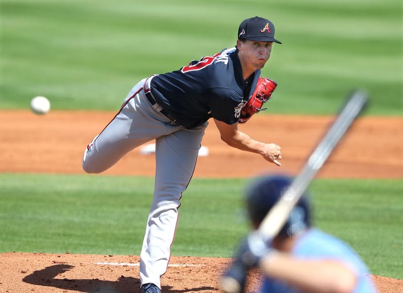 Atlanta Braves starter Kyle Wright delivers against the Tampa Bay Rays during the first inning of the spring training opener Sunday, Feb. 28, 2021, at Charlotte Sports Park in Port Charlotte, Fla. Wright pitched a scoreless first frame before surrendering consecutive one-out doubles in the second. (Curtis Compton / Curtis.Compton@ajc.com)