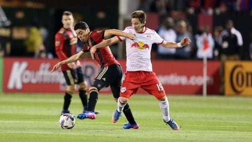 MARCH 5, 2017 Atlanta, Atlanta United midfielder Miguel Almiron battles for the ball with New York Red Bulls midfielder Alex Muyl in the the first game for the Five Stripes. (Miguel Martinez / Mundo Hispanico)