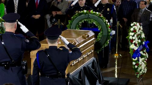Visitors pay their respects as the casket of Rev. Billy Graham lies in honor at the Rotunda of the U.S. Capitol this week. AP Photo/Jose Luis Magana