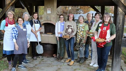 Participants in the John C. Campbell Folk School culinary class during its recent Shaker-themed week learned various Shaker cooking methods and recipes. Shown from left are teaching assistant Bonnie Lenneman, Teresa Pratt, Cindy Brannon, instructor Nanette Davidson, Diana Kealey, AJC food and dining editor Ligaya Figueras, Marcia Barbiero, Tim Parmley, Susan Greene and Gwen Kephart. CONTRIBUTED BY JOHN C. CAMPBELL FOLK SCHOOL