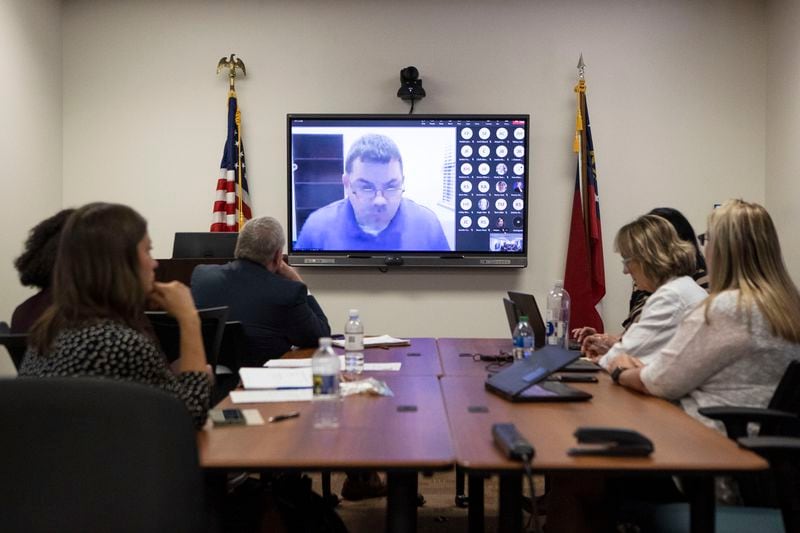 The Georgia Professional Standards Commission met virtually on Thursday, June 8, 2023, while administrators and members of the public watched from a boardroom in Atlanta. (Christina Matacotta for The Atlanta Journal-Constitution)