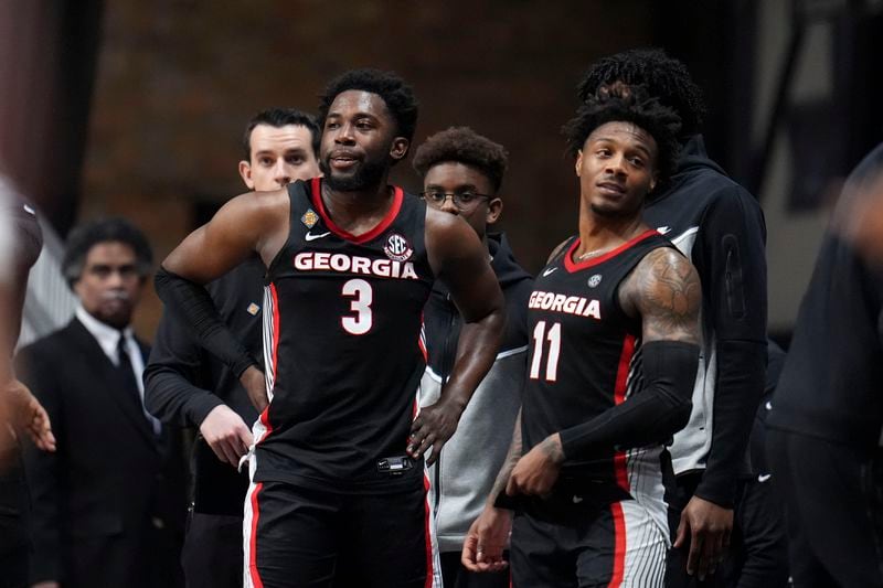 Georgia guard Noah Thomasson (3) and guard Justin Hill (11) watch from the bench in the second half of an NCAA college basketball game against Seton Hall in the semifinals of the NIT, Tuesday, April 2, 2024, in Indianapolis. Seton Hall won 84-67. (AP Photo/Michael Conroy)