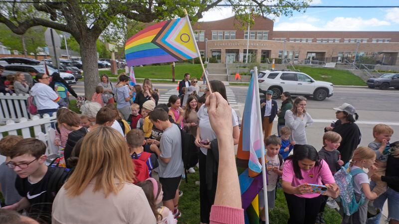 Bonneville Elementary School parents and students gather during a block party supporting trans and non binary students and staff Monday, April 29, 2024, in Salt Lake City. Utah will become the latest state to implement a transgender ban for school bathrooms and locker rooms in public schools and government-owned buildings when the law passed by the Republican controlled Legislature takes effect.(AP Photo/Rick Bowmer)