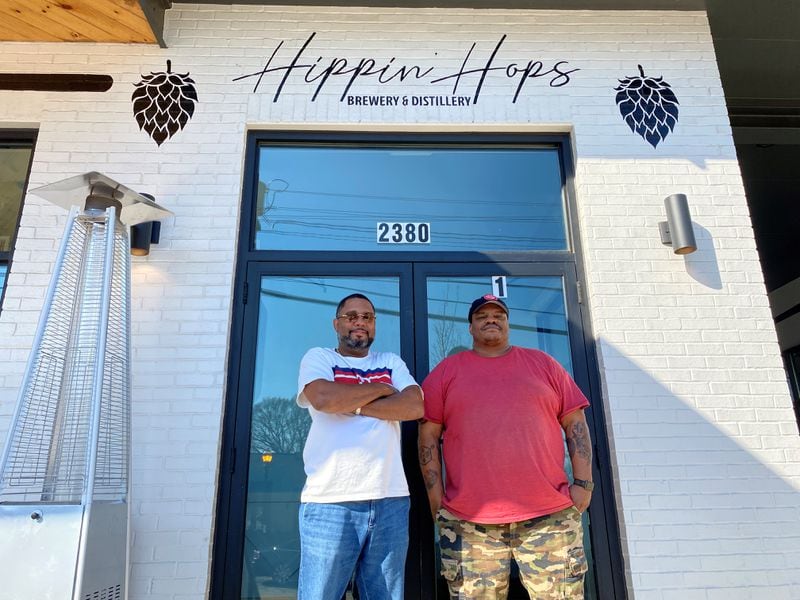 L-R Owner Clarence Boston and brewer Kevin Blodger in front of Hippin Hops Brewery and Distillery in East Lake.
Bob Townsend for the Atlanta Journal Constitution.