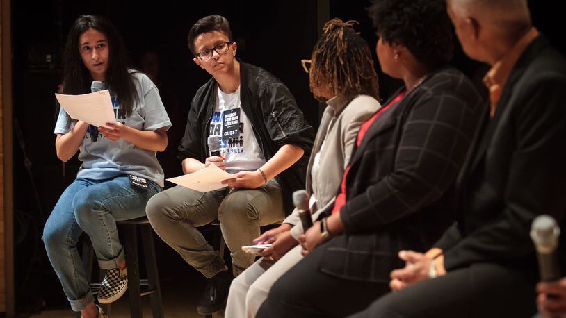 High school students Anam Hussain (left) and Joey Lopez direct questions to a panel of speakers during the Town Hall For Our Lives at the Rialto Center for the Arts in Atlanta on Saturday, April 7, 2018.  STEVE SCHAEFER / SPECIAL TO THE AJC