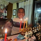Jack Kulbersh lights a menorah during Hanukkah. His father, Adam Kulbersh, co-founded Project Menorah, which encourages allies of Jews around the world to express solidarity in the face of anti-semitism. Photo: Adam Kulbersh