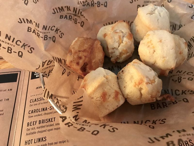 Every meal at Jim ’N Nick’s Bar-B-Q starts with cheese biscuits. LIGAYA FIGUERAS / LFIGUERAS@AJC.COM