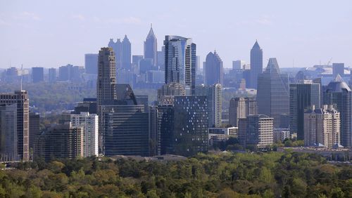 An aerial view of the Buckhead skyline, with Atlanta's downtown skyline is visible in the background. BOB ANDRES  /BANDRES@AJC.COM