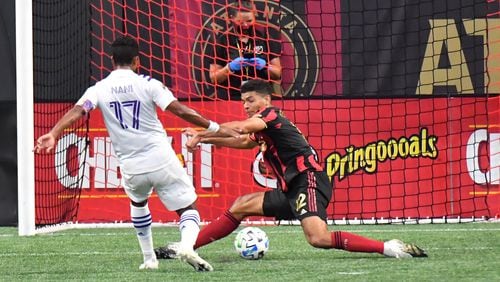 August 29, 2020 Atlanta - Orlando City forward Nani (17) makes a shot against Atlanta United defender Miles Robinson (12) on goal during the second half in a MLS soccer match at Mercedes-Benz Stadium in Atlanta on Saturday, August 29, 2020. Orlando City won 3-1 over the Atlanta United. (Hyosub Shin / Hyosub.Shin@ajc.com)