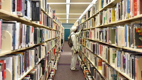 Library services are among the points of contention between Cherokee County and its cities in the ongoing service delivery impasse. The county has called on the cities to return to mediation. AJC FILE