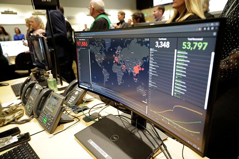 A monitor displays world-wide statistics relating to the spread of the COVID-19 coronavirus during a visit of Vice President Mike Pence to the Washington State Emergency Operations Center Thursday at Camp Murray in Washington state.