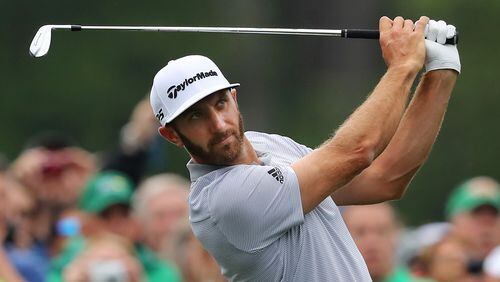 Dustin Johnson tees off on the 12th hole during his practice round for the Masters Wednesday.