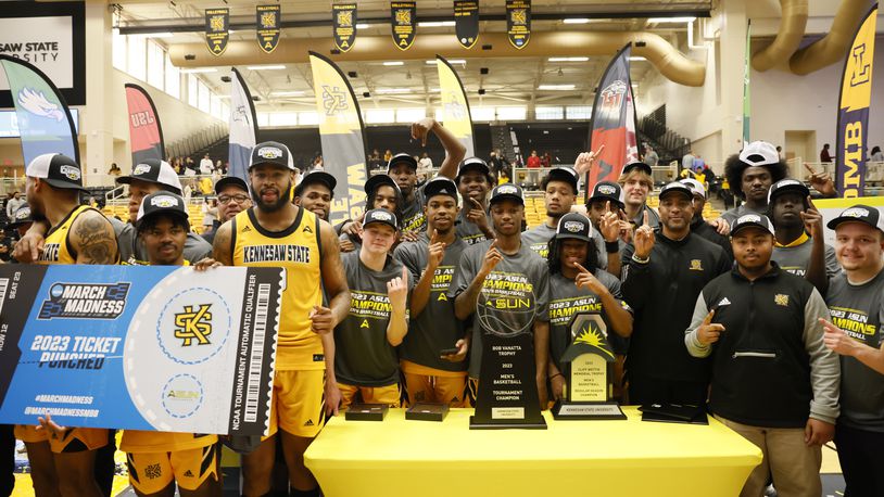 Kennesaw State poses with the trophy after the Owls defeated Liberty to advance to the NCAA Tournament for the first time in school history. (Miguel Martinez /miguel.martinezjimenez@ajc.com)