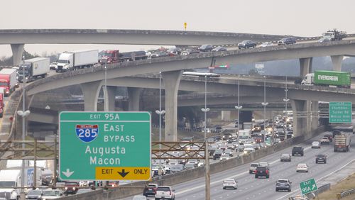 Traffic travels on the northbound overpass from I-285 West onto I-85 north at Spaghetti Junction on Jan. 30 in Doraville, Ga.. Jason Getz / Jason.Getz@ajc.com)
