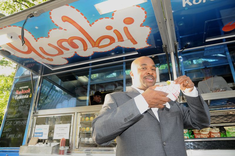 Atlanta City Council member Kwanza Hall enjoys a food-truck feast.