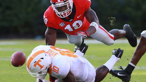 Georgia defensive back Deandre Baker breaks up a pass by leveling Tennessee wide receiver Tyler Byrd during a September game in Athens. (Curtis Compton/ccompton@ajc.com).