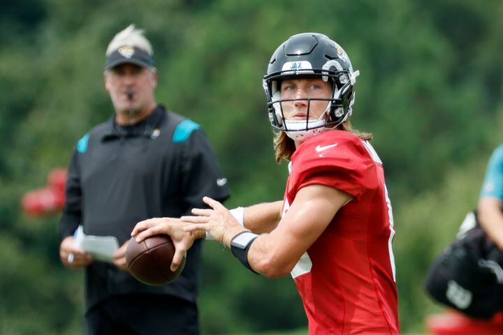 Jacksonville Jaguars quarterback Trevor Lawrence (16) looks to pass as the Jaguars head coach Doug Pederson looks during a joint training camp at the Falcons Practice Facility on Wednesday, August 24, 2022, in Flowery Branch, Ga. Miguel Martinez / miguel.martinezjimenez@ajc.com
