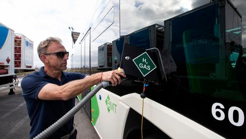 A driver fills the tank of an urban bus with green hydrogen at the bus depot of the municipal transport company in Palma de Mallorca on April 12, 2023. (Jaime Reina/AFP/Getty Images/TNS)