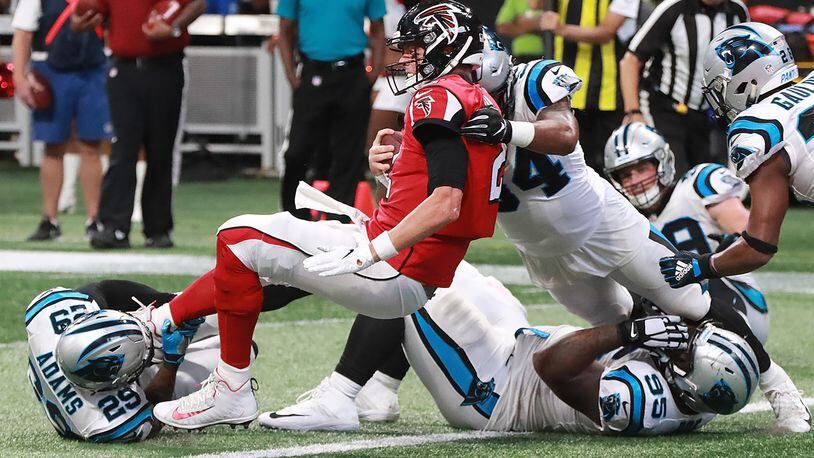 Matt Ryan scores to give the Atlanta Falcons a 31-17 lead over the Carolina Panthers during the fourth quarter ion Sunday, Sept 16, 2018, in Atlanta.