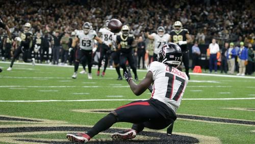 Falcons receiver Olamide Zaccheaus makes a touchdown catch against the Saints during a game last season in New Orleans. Zaccheaus, who was tendered last month, signed a one-year contract with the Falcons on Tuesday. (AP Photo/Butch Dill)