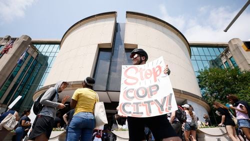 Jacob Croman from Covington held a sign outside the City Hall as they protested the planned Police Training Center on Monday, June 5, 2023.
Miguel Martinez /miguel.martinezjimenez@ajc.com