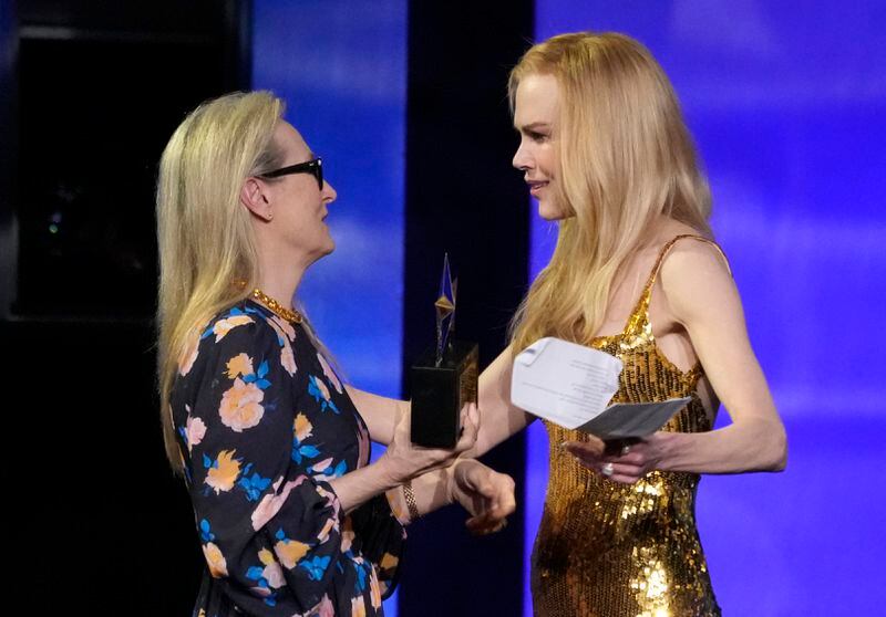 Honoree Nicole Kidman, right, accepts the 49th AFI Life Achievement Award from presenter Meryl Streep, Saturday, April 27, 2024, at the Dolby Theatre in Los Angeles. (AP Photo/Chris Pizzello)