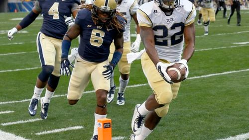 Georgia Tech running back Broderick Snoddy (22) outruns Pittsburgh linebacker Todd Thomas (8) for a touchdown in the first quarter of an NCAA football game, Saturday, Oct. 25, 2014, in Pittsburgh. (AP Photo/Keith Srakocic) Tech's Broderick Snoddy runs for one of his three touchdowns against Pitt. (AP photo)