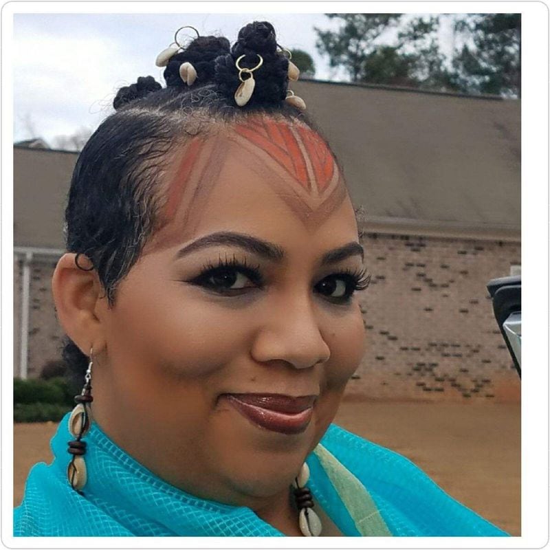 Raye-John Luttrell, a Colour client, gets a makeover complete with an Afro-futurist Bantu knot faux hawk, with cowrie bead details, she sported at several “Black Panther” events she attended with her daughter. CONTRIBUTED