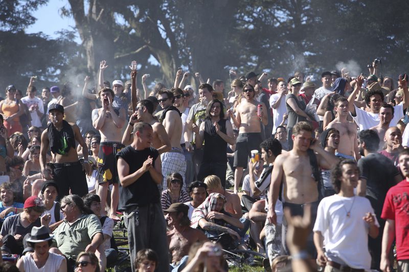 FILE - A large crowd cheers as the time reaches 4:20 p.m., on Hippie Hill in Golden Gate Park in San Francisco, April 20, 2009. Marijuana advocates are gearing up for Saturday, April 20, 2024. Known as 4/20, marijuana's high holiday is marked by large crowds gathering in parks, at festivals and on college campuses to smoke together. This year, activists can reflect on how far the movement has come. (AP Photo/Jeff Chiu, File)