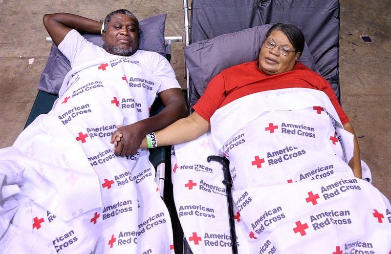September 10, 2017 Albany: Local residents Clarence & Virginia Robinson move into the Red Cross shelter at the Albany Civic Center to ride out Hurricane Irma on Sunday, September 10, 2017, in Albany. The couple have survived Tropical Storm Alberto in 1994 that killed five people in Dougherty County and more recently two tornado strikes in January of this year that killed four. Virginia Robinson said â I feel more safe here and our street is already floodingâ.     Curtis Compton/ccompton@ajc.com