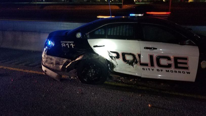 A Morrow police cruiser was hit Wednesday night while the officer was helping a stranded motorist on the side of I-75 South.