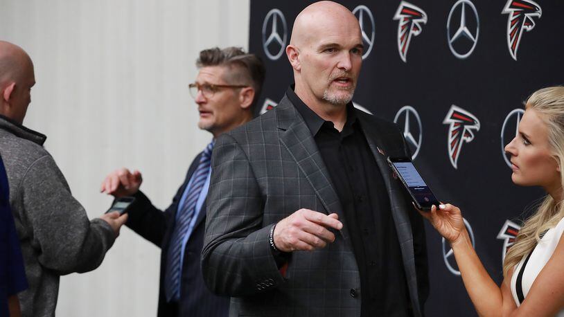 April 26, 2019 Flowery Branch: The Atlanta Falcons head coach Dan Quinn and general manager Thomas Dimitroff discuss their first-round draft picks with the media at the team indoor practice facility on Friday, April 26, 2019, in Flowery Branch.    Curtis Compton/ccompton@ajc.com