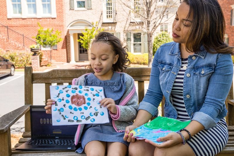 Alani Thorns, 8, started raising money with an online art show, with the help of her mother Amanda Moore. Jenni Girtman/Atlanta Journal-Constitution