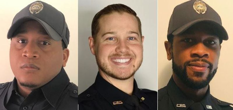 Officer Danny Bride, Sgt. Matt Madden and Officer Cepada Huff helped rescue a newborn April 13 after the family crashed on the way to the hospital. 