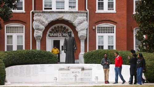 Morehouse College tour guide brings prospective students to the Benjamin E. Mays Memorial in front of Graves Hall  on the Morehouse College campus, Monday, March 18, 2024, in Atlanta. (Jason Getz / jason.getz@ajc.com)