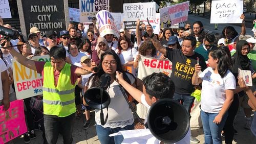 Hundreds of activists on Monday demonstrated outside the Atlanta City Detention Center in favor of an Obama administration program that temporarily shields young immigrants from deportation.